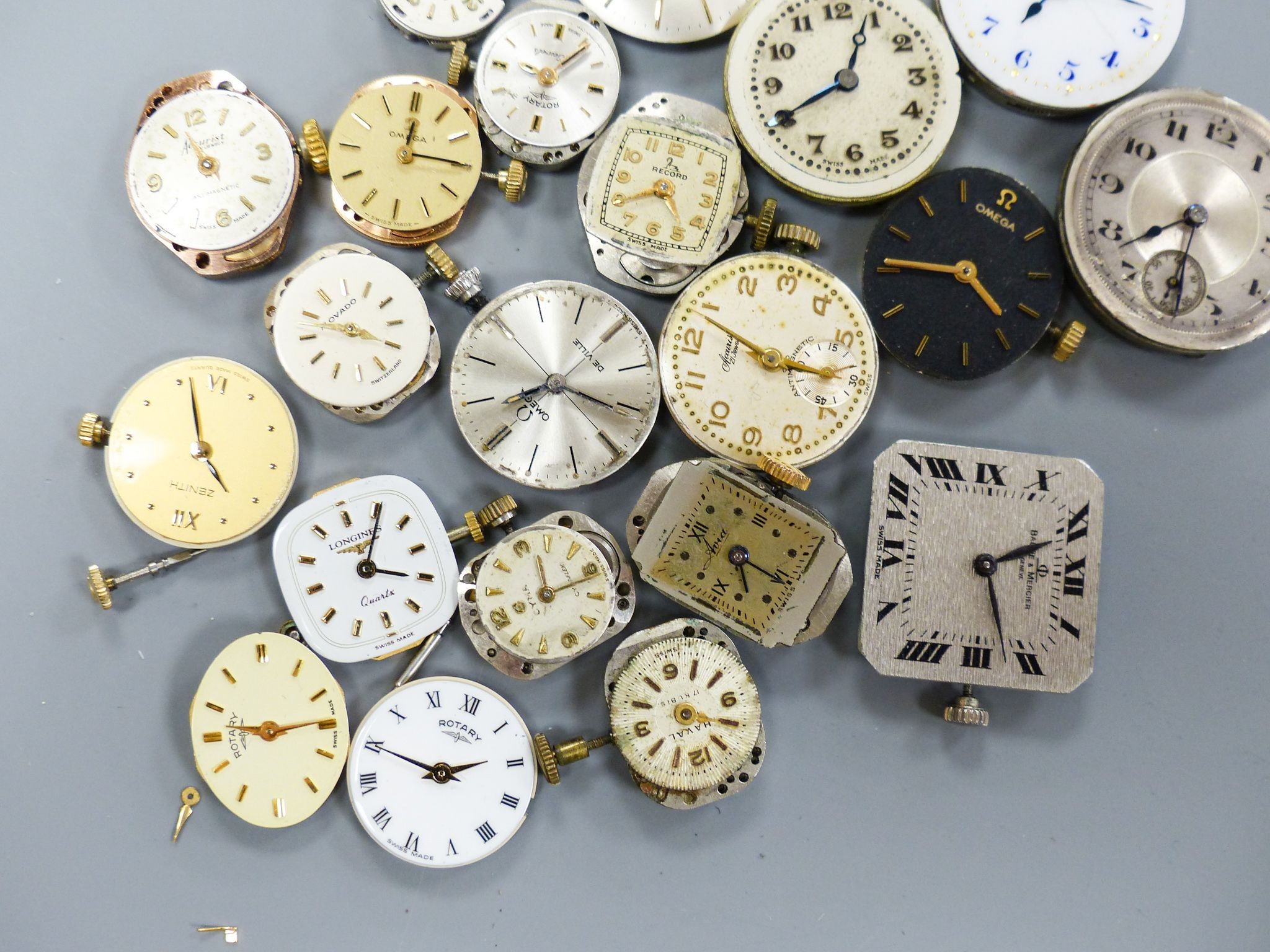 A small quantity of wrist watch movements including Baume & Mercier, Omega and Rotary.